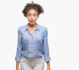 Young afro american woman over isolated background afraid and shocked with surprise expression