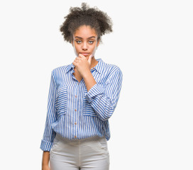 Young afro american woman over isolated background looking confident at the camera with smile with crossed arms and hand raised on chin