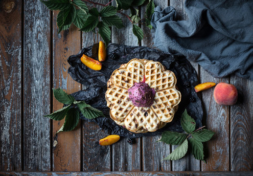 Vegan stracciatella waffle with blackberry and peach ice cream