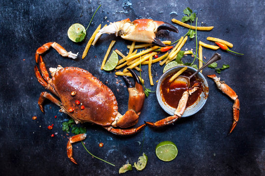 Whole portland crab with fries and a spicy sauce
