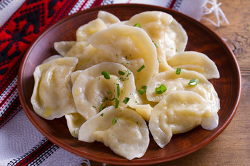Dumplings, filled with mashed potato. Varenyky, vareniki, pierogi, pyrohy - dumplings with filling, popular dish in many countries
