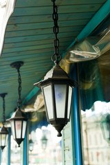 Fototapeta na wymiar stylized street lamp under the roof