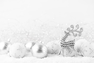 Christmas greeting card. Festive decoration on bokex silver background. New Year concept. Copy space.  Flat lay. Top view.