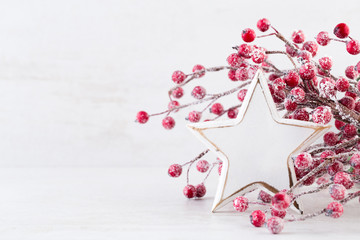 Christmas greeting card. Christmas tree branch on glitter golden bokeh lights background. New Year concept. Copy space.