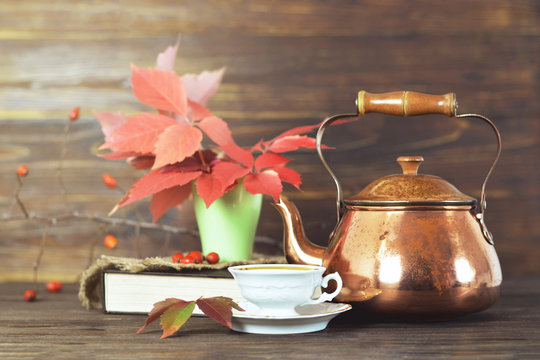 Tea in old copper teapot. Autumn still life