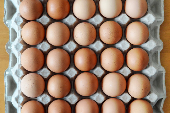 Top view of fresh eggs in box