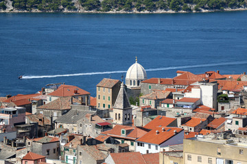 Obraz premium Historic city centre of Sibenik, Croatia with the dome of the Cathedral of St. James, famous UNESCO World Heritage Site. Adriatic Sea in the background. View from the Barone Fortress. 