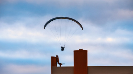 A paraglider in the evening sky of Puerto de la Cruz.