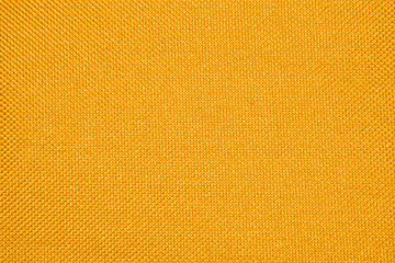 Yellow texture of binding fabric.Yellow fabric background.Yellow fabric. Background with a textured...