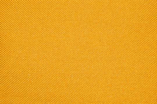 Yellow texture of binding fabric.Yellow fabric background.Yellow fabric. Background with a textured surface.