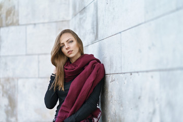 young woman against wall