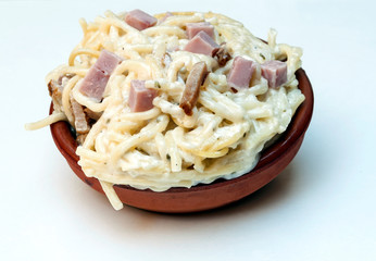 Spaghetti a la carbonara surrounded by white background