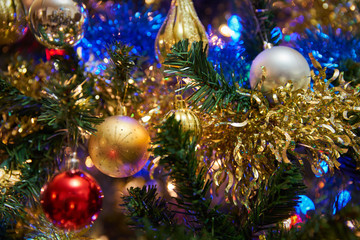 Christmas Ornaments on a Christmas Tree. Decorations and lights hang on a Christmas tree.