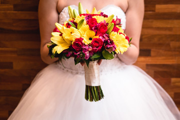 Bridal bouquet in rustic place, for use in wedding websites or blogs.