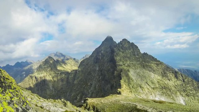 Peaks in High Tatras Mountains: mt.Vysoka (2547m) (on the Left) and mt.Tazky Stit (2500m) (Right), Vysoke Tatry, Slovakia. Picturesque view from the famous mount Rysy (2503m). Time Lapse
