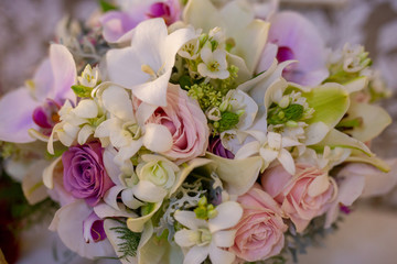 Bridal bouquet in rustic place, for use in wedding websites or blogs.