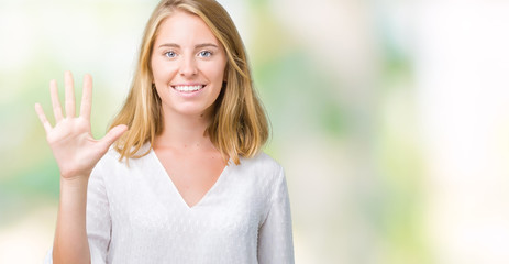 Beautiful young elegant woman over isolated background showing and pointing up with fingers number five while smiling confident and happy.