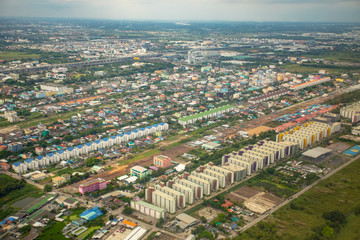 high angle view of condominium building and home village over outskirt of bangkok thailand capital