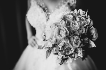 Bridal bouquet in rustic place, for use in wedding websites or blogs.