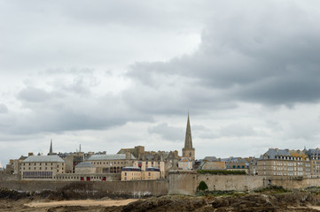 View of the walled city of Saint Malo, with the steeple of the cathedral protruding above the...