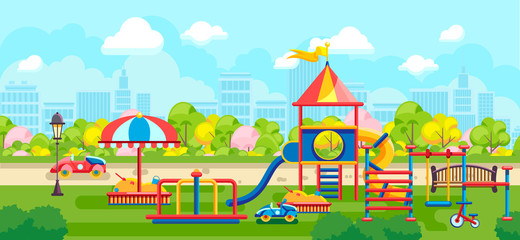 Colorful playground constructions on green meadow in city park on urban background © studioworkstock