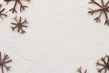 Top view of snowflakes made from wood on white background. Christmas concept.