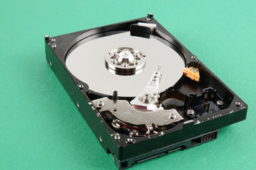 Hard disk drive (HDD) isolated on a green background