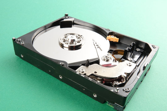 Hard disk drive (HDD) isolated on a green background