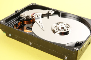Hard disk drive (HDD) isolated on a yellow background