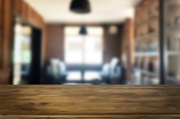 Wooden board empty Table Top And Blur Interior over blur in coffee shop Background, Mock up for display of product