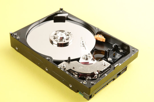 Hard disk drive (HDD) isolated on a yellow background