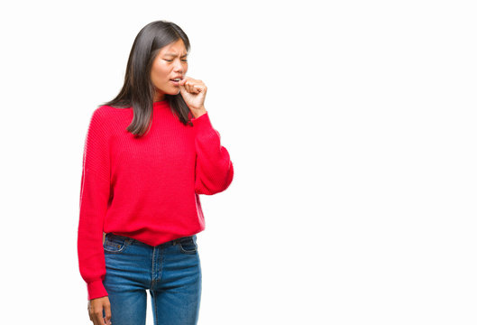 Young asian woman wearing winter sweater over isolated background feeling unwell and coughing as symptom for cold or bronchitis. Healthcare concept.