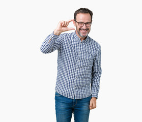 Handsome middle age elegant senior business man wearing glasses over isolated background smiling and confident gesturing with hand doing size sign with fingers while looking and the camera