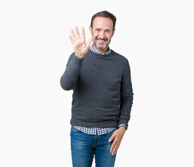 Naklejka premium Handsome middle age senior man wearing a sweater over isolated background showing and pointing up with fingers number five while smiling confident and happy.