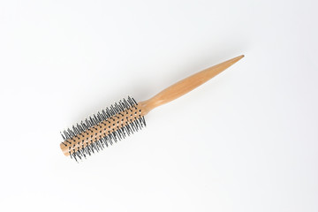 Round hair brush comb on white background