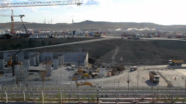 Construction site, trucks and crane