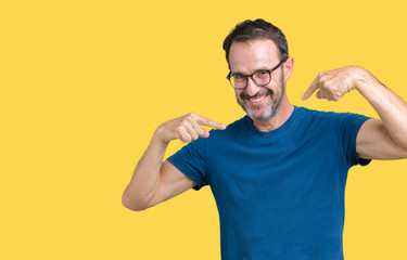 Handsome middle age hoary senior man wearin glasses over isolated background looking confident with...