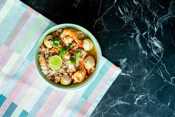 Thai food background. Dishes of thai cuisine.Black stone  table background.