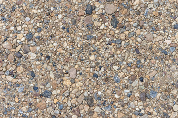 Colorful sand or pebble texture. Seamless texture on ground.