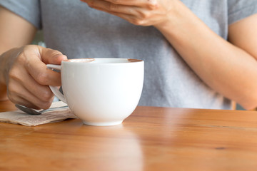 Woman enjoying warming drink, Late coffee in a cup