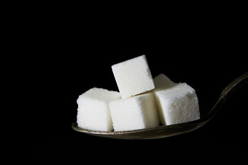 Sugar cube on spoon 
