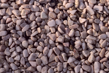 Background of smooth white pebbles. The concept of nature. Cropped shot, close-up, horizontal, top view
