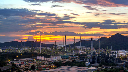 Beautiful sunset  petrochemical oil refinery factory plant cityscape of Chonburi province at night , landscape Thailand