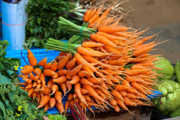Mini carrots for sell at the small market place of the village