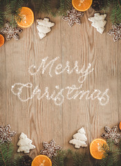 Christmas holidays composition on wooden background with inscription Merry Christmas. Christmas card. Top view. Holiday concept