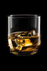 Glass of whisky isolated on black background