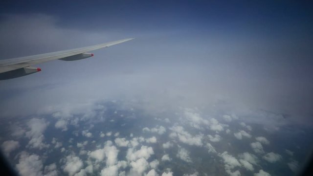 passenger palne flying through rain cloud 
