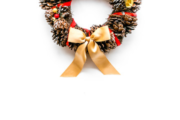 Christmas wreath made of pine cones on white background top view space for text