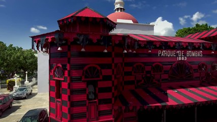 Pan shot of fire station (Parque de Bombas) in Ponce, PR and aerial view of area