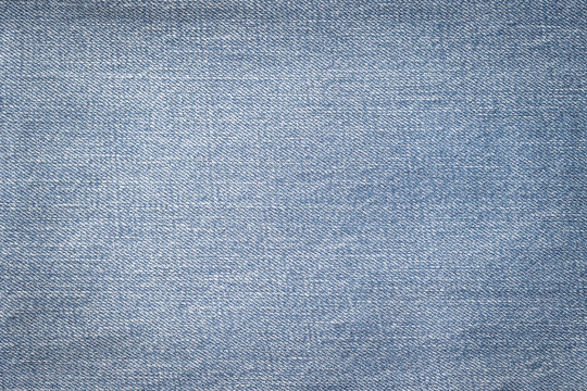 Blue jeans denim fabric textile texture background for National denim day or month.